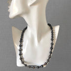 A beaded necklace made with Landscape Jasper and Larvikite Labradorite stones