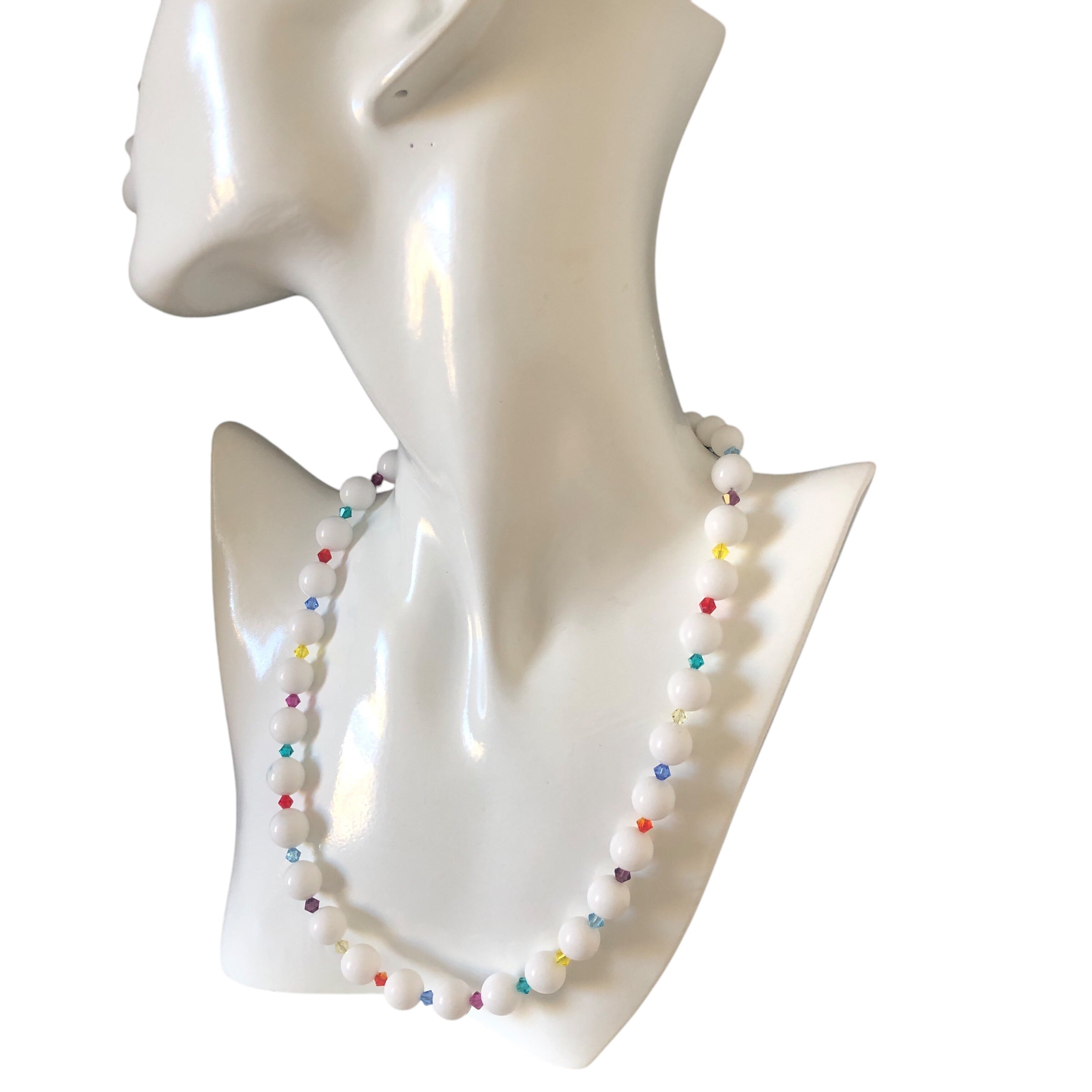 A beaded necklace with white quartz and multicolored Swarovski crystals