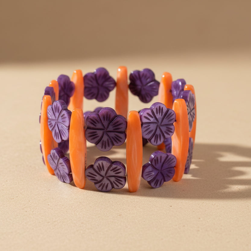 An orange and purple mother of pearl bracelet 