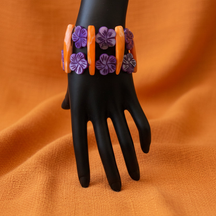 An orange and purple mother of pearl bracelet 