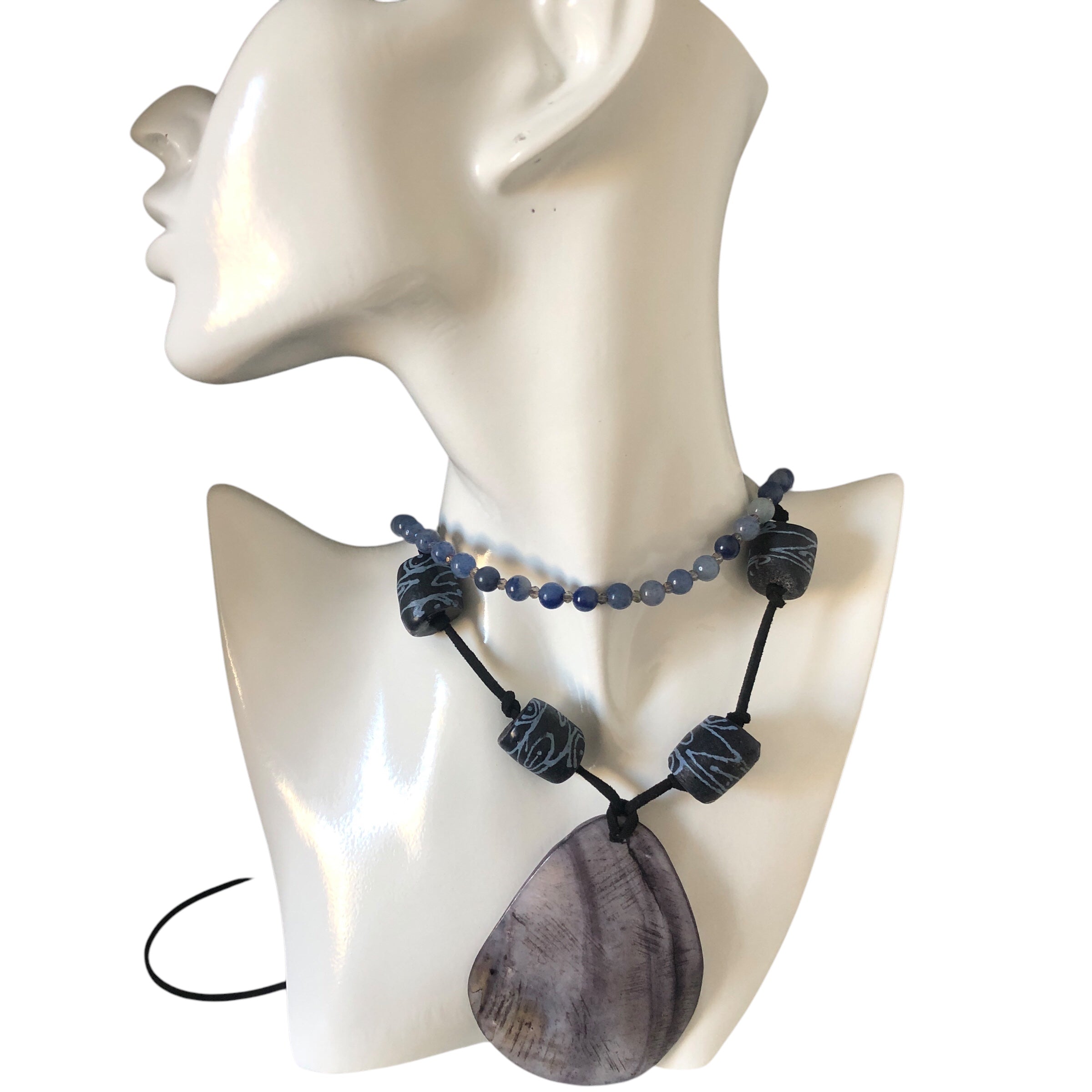 necklace with a large Mother of Pearl drop pendant and Gotland glass beads, on a black suede strap.